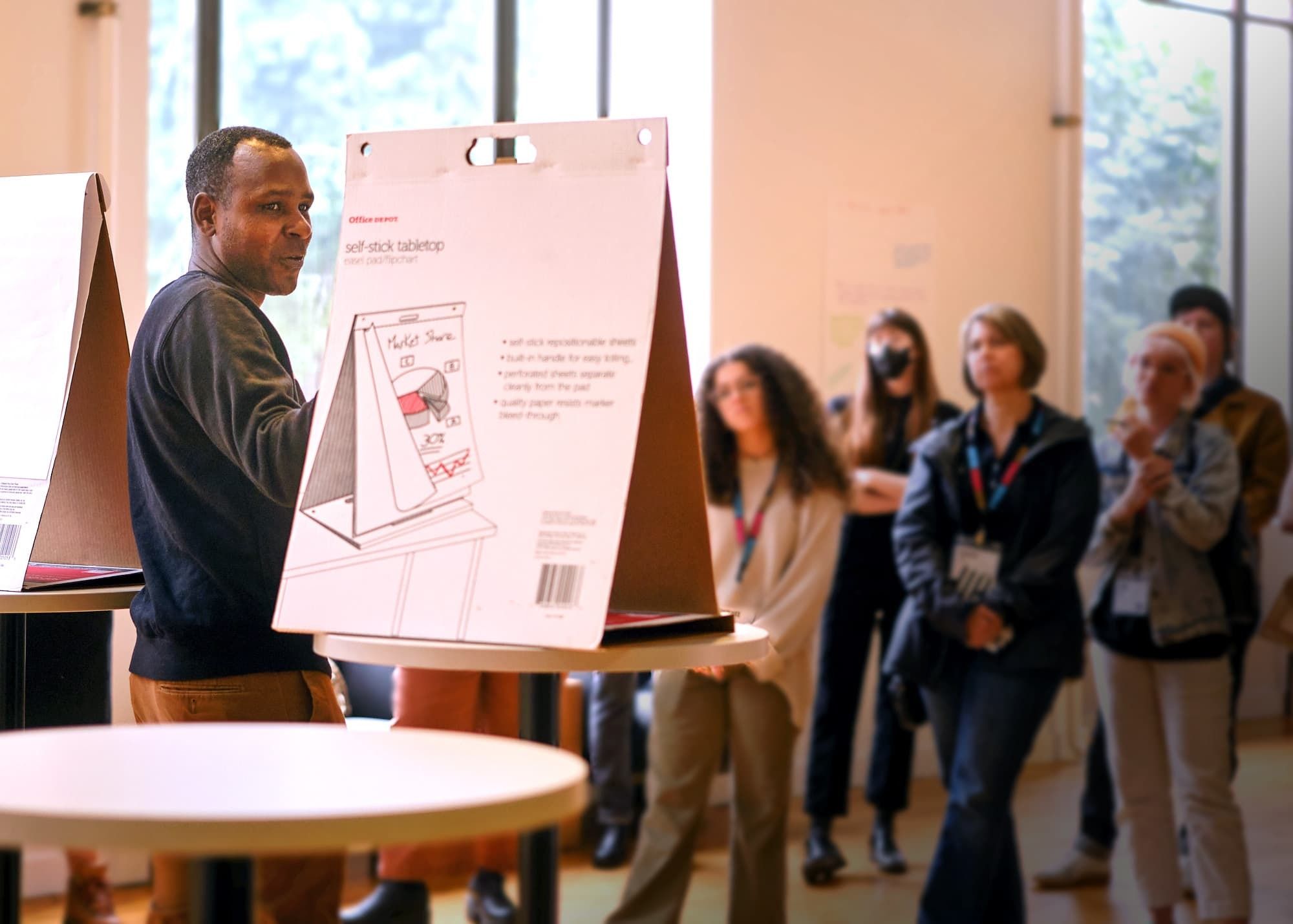 18F Design Director Ron Bronson speaks to a crowd at AIGA Portland in 2024.